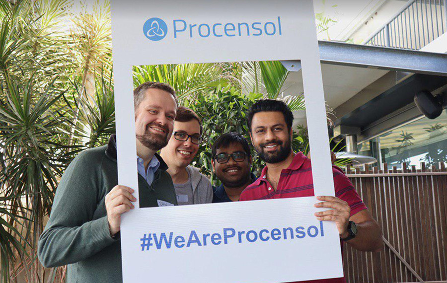 Procensol workers hold a "We are Procensol" sign