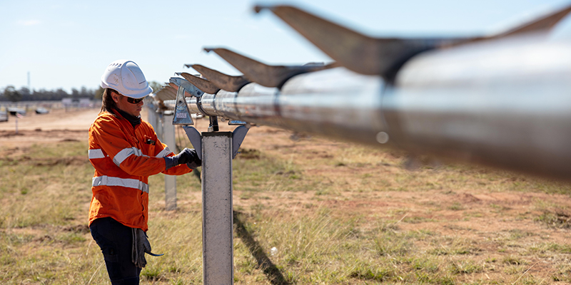 Photo of woman in safety gear working outdoors